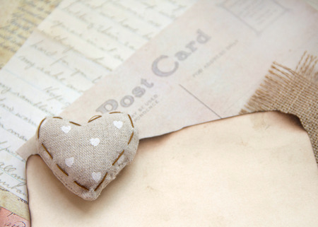 Shabby chic heart on vintage postcard and paperの写真素材