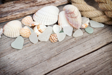 Wood, rope, sea glass and seashells の写真素材