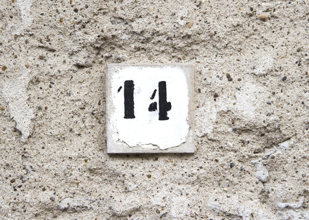 Number fourteen on old wall の写真素材