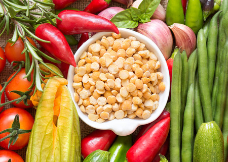 Raw Organic yellow peas and vegetablesの写真素材
