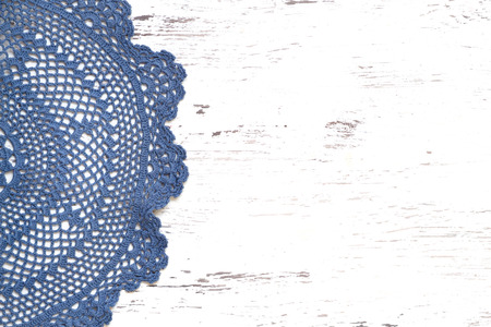 Blue Crochet doily border over shabby chic woodの写真素材