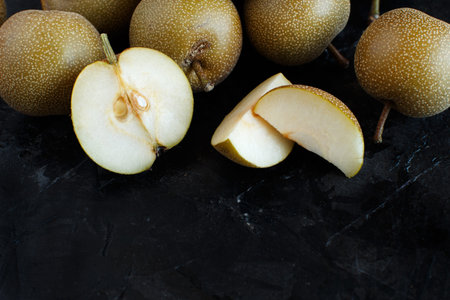 Nashi Pears (apple pears or asian pears) on a dark backgroundの写真素材
