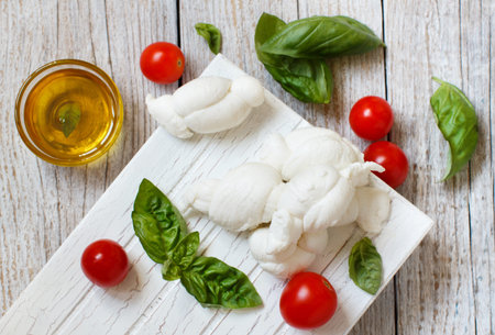 Italian cheese mozzarella nodini with tomatoes and  herbs