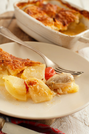Codfish with potatoes cooked in the ovenの写真素材