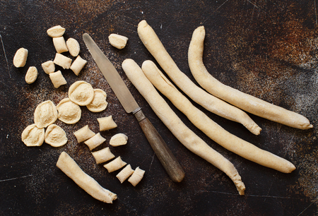 Making whole wheat flour pasta orecchiette from Puglia, Italyの写真素材