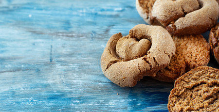 Frisella, typical south italian bread on a blue wooden table