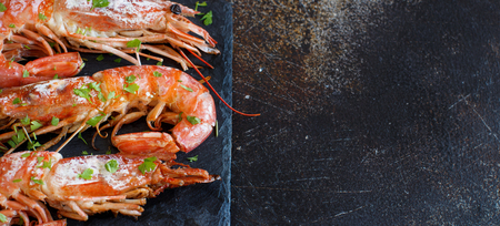 Grilled shrimps with lemon on wood close upの写真素材