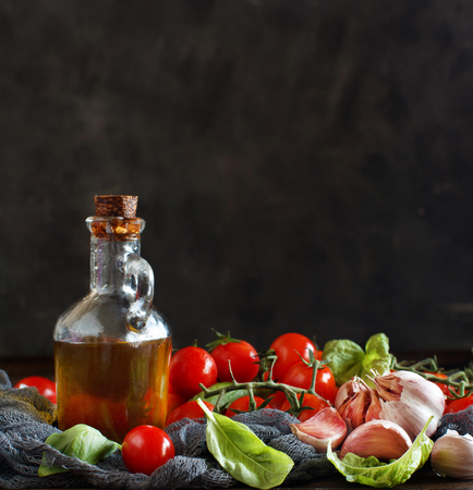 Ingredients for italian tomato sauce -  Cherry tomatoes, garlic, basil and olive oilの写真素材