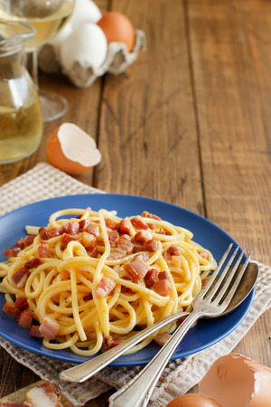 Traditional italian dish spaghetti carbonara with bacon, egg and cheeseの写真素材