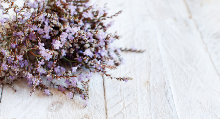 Spring background with flowers on a wooden background close upの写真素材