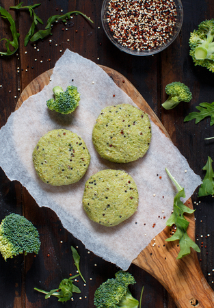 Vegetarian broccoli and quinoa burgers ready to cookの写真素材