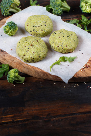Vegetarian broccoli and quinoa burgers ready to cookの写真素材