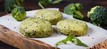 Vegetarian broccoli and quinoa burgers ready to cookの写真素材