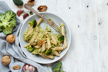 Wholegrain Pasta with broccoli and walnuts cream close upの写真素材