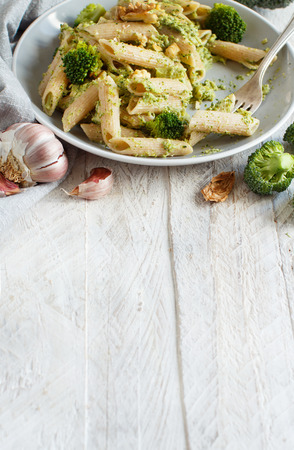 Wholegrain Pasta with broccoli and walnuts cream close upの写真素材