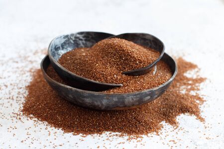 Uncooked teff grain in a bowls close upの写真素材