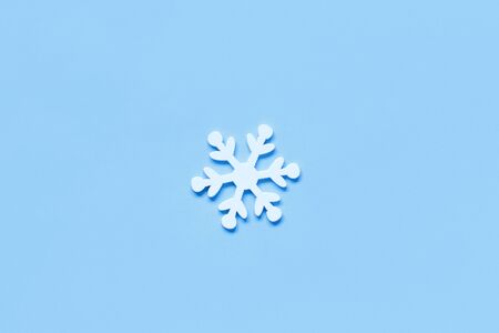 White Christmas snowflake on a light blue background top viewの写真素材