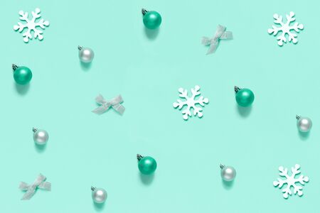 Christmas decorations on a light green background top viewの写真素材