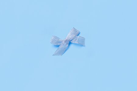 Silver Christmas bowon a light blue background top viewの写真素材