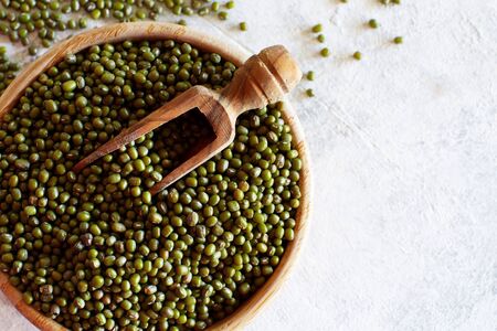 Dried mung beans in wooden bowl close upの写真素材