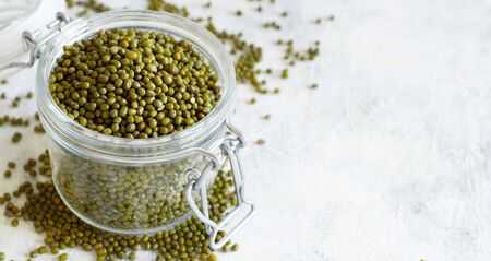 Dried mung beans in a glass jar close upの写真素材