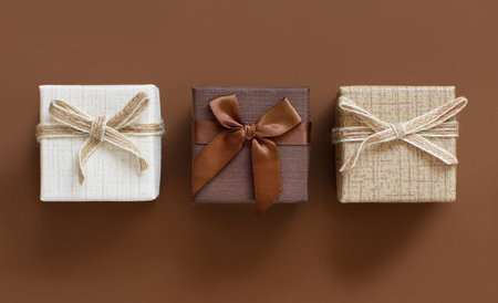 Brown tones gift boxes on a brown background top view