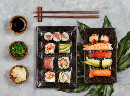 Sushi Set nigiri and sushi rolls on rectangular plates top viewの写真素材