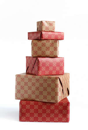 Ecru and red patterned Gift boxes isolated on white close upの写真素材
