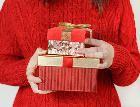 Young woman with Gift boxes in hands close up