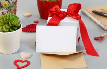 Valentines Day present with black paper card close up on grey tableの写真素材