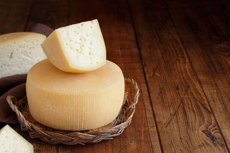 Pieces of  fresh homemade italian cheese on a tray close upの写真素材