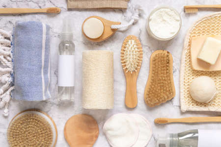 Organic natural cosmetics and zero waste reusable accessories for skin and hair care on marble flat lay. Top view of eco friendly beauty products for bath, massage or spa salonの写真素材