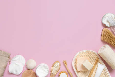 Organic natural cosmetics and zero waste reusable accessories for skin and hair care on pink flat lay with copy space. Top view of eco friendly beauty products for bath, massage or spa salonの写真素材