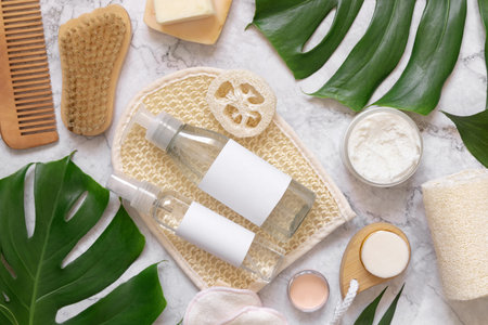 Homemade organic cosmetics and eco friendly accessories near monstera leaves flat lay, copy space....