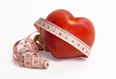  Weight and heart. Vegetables and measuring tape for a healthy lifestyleの写真素材