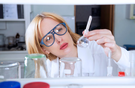 Woman scientist with laboratory flask