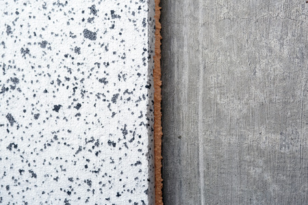 Polyurethane insulation foam between polystyrene foam concrete wall. Foam black and white background.の写真素材