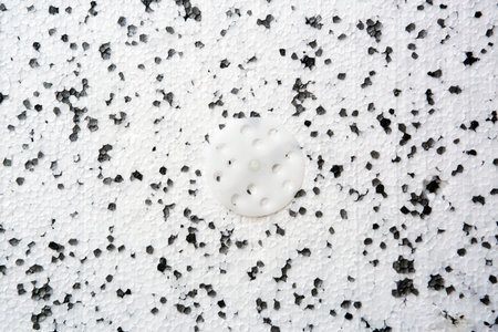 Sliced polystyrene texture with plastic mount. Foam black and white background.の写真素材