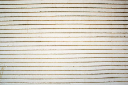 Fragment of Stone white pavement surface texture with horizontal stripes as a background. Horizontal top view shot with space for text.の写真素材