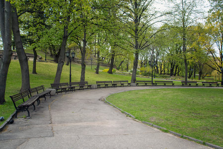 Small artificial waterfalls at Bastion Hill park in Riga, Latvia. Empty walking lane. Front view....