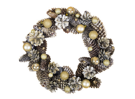 Christmas wreath of cones and gold balls isolated on white background.の写真素材