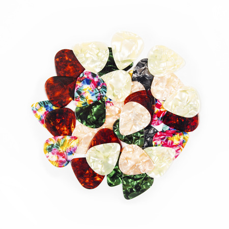 Guitar plectrums isolated on a white backgroundの写真素材