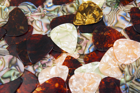 Black guitar plectrums close up  background. Music conceptの写真素材