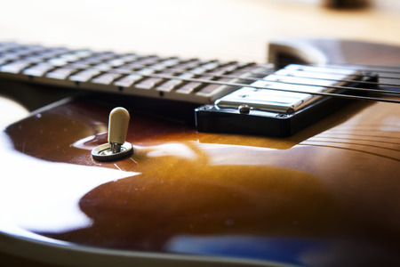 Acoustic guitar close up in dark backgroundの写真素材