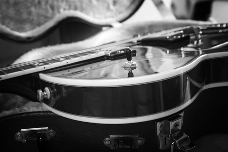 Acoustic guitar close up in dark backgroundの写真素材