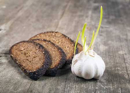 Black bread and garlicの写真素材