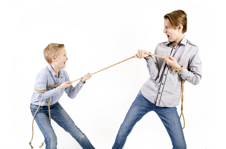 Brothers. Connected by a rope.の写真素材