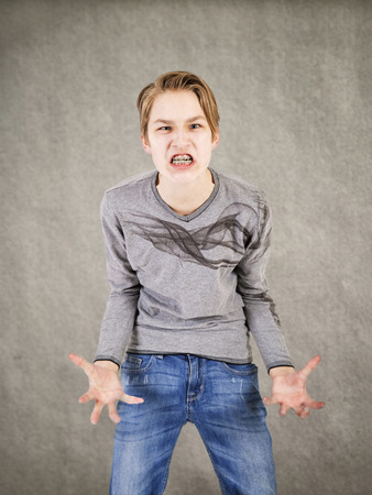 Emotional boy with bracesの写真素材