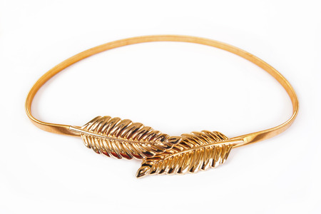 Women's gold belt is isolated on a white backgroundの写真素材