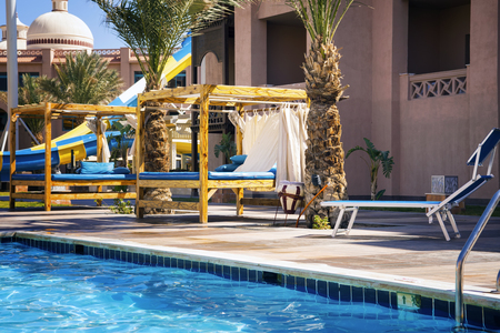 Blue sun chair on the background of  swimming poolの写真素材